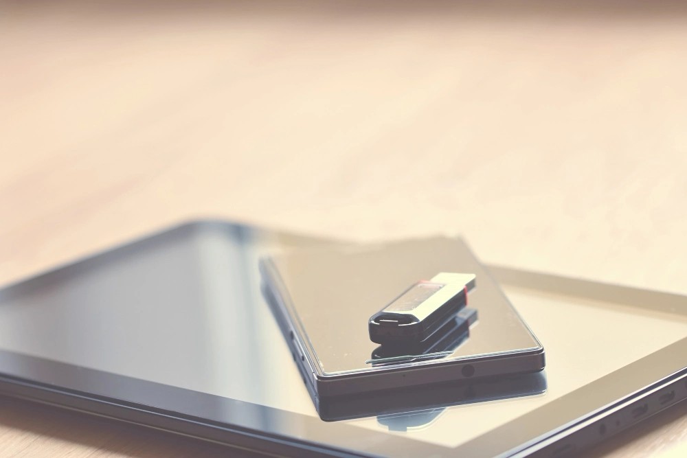 USB flash drive on a tablet, illustrating storage capacity choices for custom USB flash drives Dubai buyers order